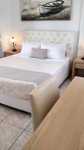 Uma cama ou camas num quarto em Hotel Mylos