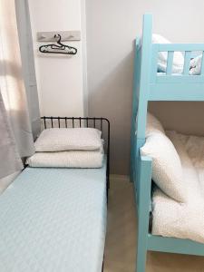 a bunk bed room with two bunk beds and a ladder at Y.ROAD 135 in Seoul