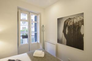 เตียงในห้องที่ MAI BY OLDTOWN APARTMENTS