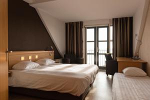 Postel nebo postele na pokoji v ubytování Hotel Hoogeerd by Flow Niftrik - Nijmegen