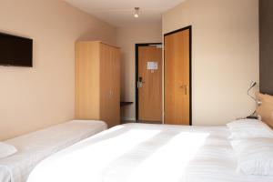 Postel nebo postele na pokoji v ubytování Hotel Hoogeerd by Flow Niftrik - Nijmegen
