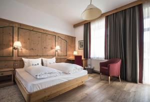 Ένα ή περισσότερα κρεβάτια σε δωμάτιο στο Hotel Cristallo