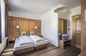 Ένα ή περισσότερα κρεβάτια σε δωμάτιο στο Hotel Cristallo