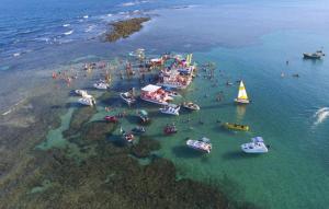 an aerial view of a group of boats in the water at Pousada e Restaurante Stella Maris in São José da Coroa Grande