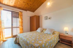 Postel nebo postele na pokoji v ubytování Apartmani Ivan Pula