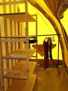 a ladder in a tent with a shelf in it at Agriturismo Unico Senso - Glamping in Montottone