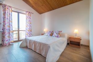 Postel nebo postele na pokoji v ubytování Apartmani Ivan Pula