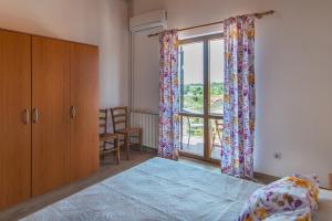 Postel nebo postele na pokoji v ubytování Apartmani Ivan Pula