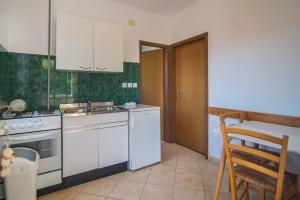 Kuchyň nebo kuchyňský kout v ubytování Apartmani Ivan Pula