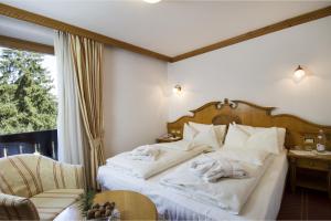 Ένα ή περισσότερα κρεβάτια σε δωμάτιο στο Hotel Lorenzetti