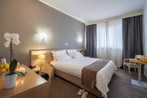 Postel nebo postele na pokoji v ubytování Nestos Hotel