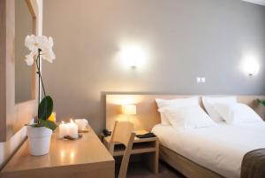 Postel nebo postele na pokoji v ubytování Nestos Hotel