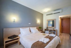 Postel nebo postele na pokoji v ubytování Nestos Hotel