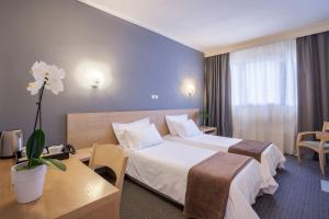 Postel nebo postele na pokoji v ubytování Nestos Hotel