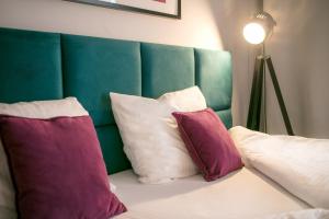 Ένα ή περισσότερα κρεβάτια σε δωμάτιο στο Baltin Hotel & SPA ****