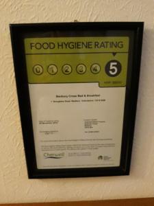 a food hygiene rating sign hanging on a wall at Banbury Cross B&B in Banbury