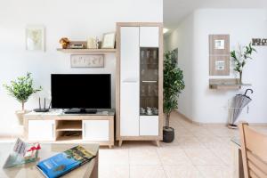 TV a/nebo společenská místnost v ubytování Vivienda Vacacional La Laguna Deluxe 6