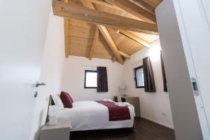 Voodi või voodid majutusasutuse Hotel Cascina Fossata & Residence toas