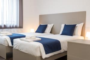 Voodi või voodid majutusasutuse Hotel Cascina Fossata & Residence toas