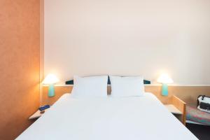 Letto o letti in una camera di ibis Luxembourg Sud