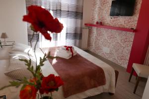 Postel nebo postele na pokoji v ubytování B&B Ai Tre Archi