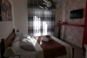 Postel nebo postele na pokoji v ubytování B&B Ai Tre Archi