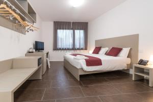 Voodi või voodid majutusasutuse Hotel Cascina Fossata & Residence toas