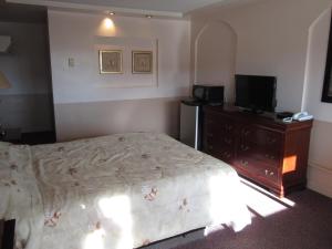 Postel nebo postele na pokoji v ubytování Traveller's Inn