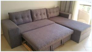 a large couch in a living room at One- bedroom apartment S3 in Vip Zone Sunny Lakes in Sharm El Sheikh +36 photos