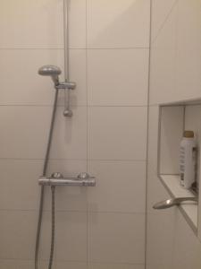a shower in a bathroom with a glass door at Slapen bij Van-V in Zierikzee +28 photos