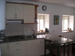 a kitchen with a sink and a counter top at Apartament Casa Levante in Vejer de la Frontera