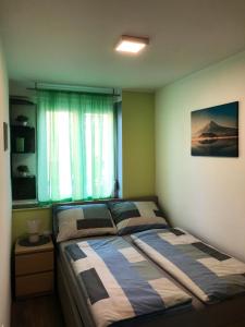 Ένα ή περισσότερα κρεβάτια σε δωμάτιο στο Apartman Anja