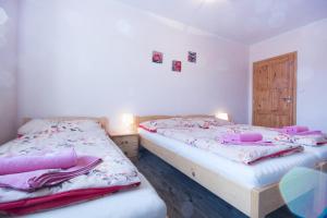 Postel nebo postele na pokoji v ubytování Penzion a vinařství Lelíkovi