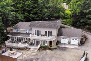 an aerial view of a white house with a porch at Marina Vista in Penn Yan