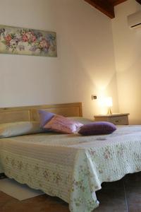 Postel nebo postele na pokoji v ubytování B&B S'ARROSA ANTIGA