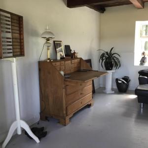 an office with a wooden desk with a lamp at Agerfeld gl. skole in Holstebro +3 photos