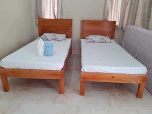 Postel nebo postele na pokoji v ubytování D's Oceanview Beach Resort