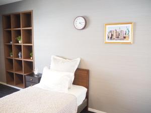 Tempat tidur dalam kamar di Guest House Bostons / Vacation STAY 5142