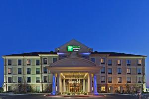 a hotel with a clock on top of a building at Holiday Inn Express & Suites Poteau by IHG in Poteau +13 photos