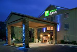 a hotel building with a sign that reads haciendas at Holiday Inn Express Mount Pleasant- Scottdale, an IHG Hotel in Mount Pleasant