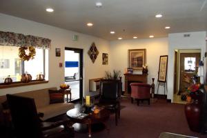 a living room with a couch and a table at Travelodge by Wyndham Elko NV in Elko