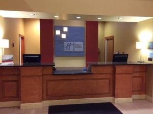 a lobby with a large screen in a hotel room at Holiday Inn Express Hotel & Suites Forest, an IHG Hotel in Forest