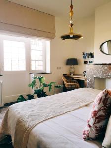Postel nebo postele na pokoji v ubytování Vakantiewoning Guesthouse MOMO