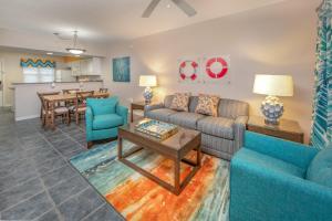 a living room with a couch and a table at Holiday Inn Club Vacations Panama City Beach Resort in Panama City Beach