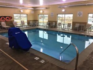 a large swimming pool with blue water in a building at Holiday Inn Express & Suites Danville, an IHG Hotel in Danville