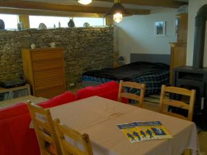 a living room with a table and a couch at Seiber 172 in Weissenkirchen in der Wachau