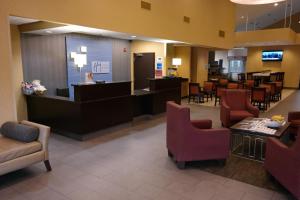 a lobby of a hospital with chairs and a waiting room at Holiday Inn Express Fredericksburg - Southpoint, an IHG Hotel in Fredericksburg