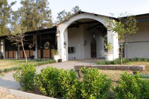 an entry to a building with an archway at The Stables, Beaulieu Kyalami in Midrand