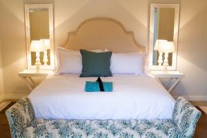 Łóżko lub łóżka w pokoju w obiekcie The Stables, Beaulieu Kyalami