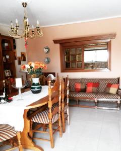 a living room with a table and a couch at Fantastic villa, a 5 minute drive from the beach! in Athens